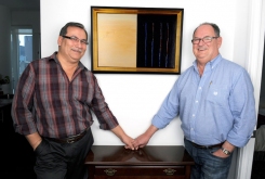 Collectors: Melvin Thompson and Harvey Bouchard, with Robert Houle painting, 2012.