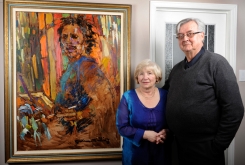 Collectors: Rudy and Gloria Bies with Arthur Shilling painting, 2012.
